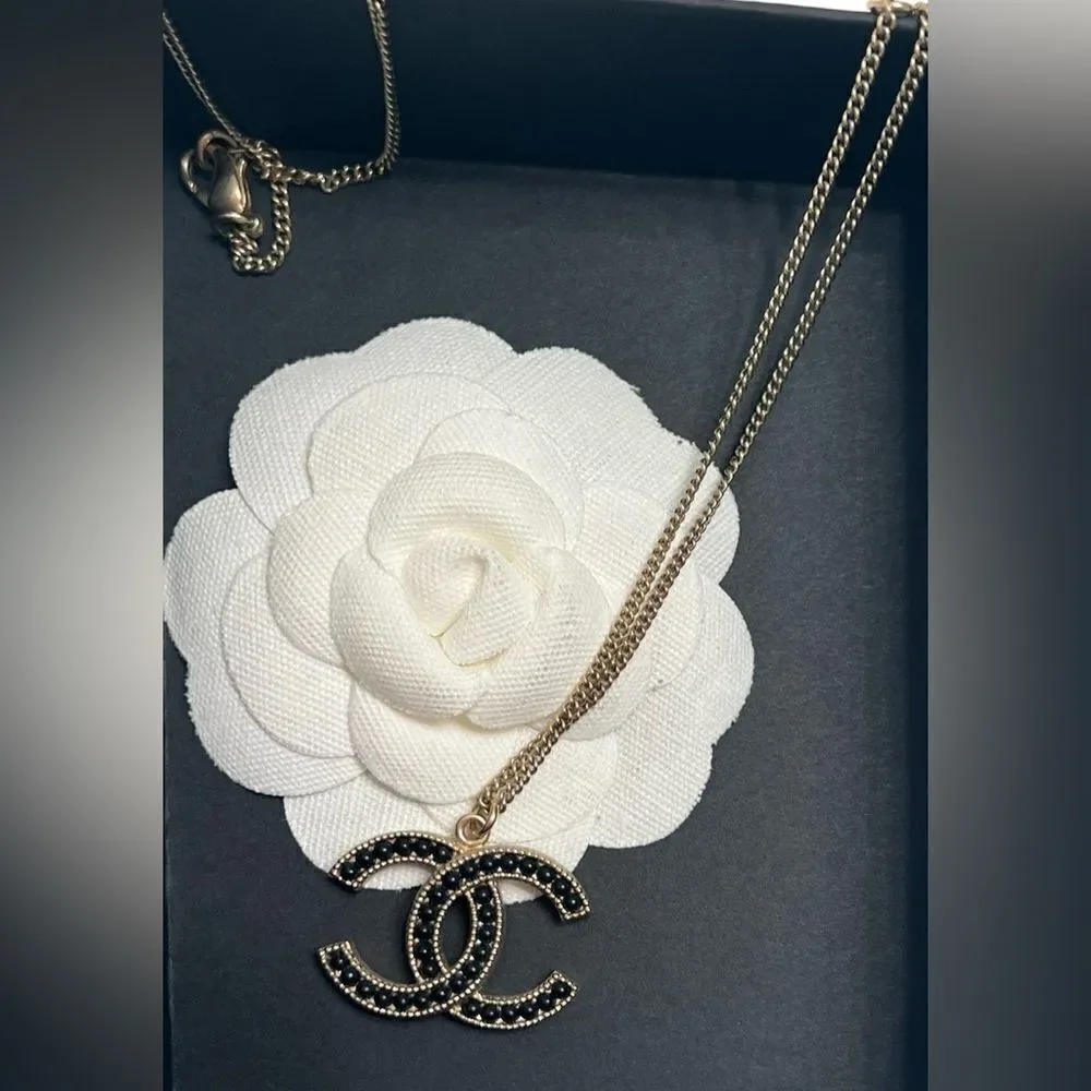 Chanel gold and black pearl CC pendant necklace, Authentic